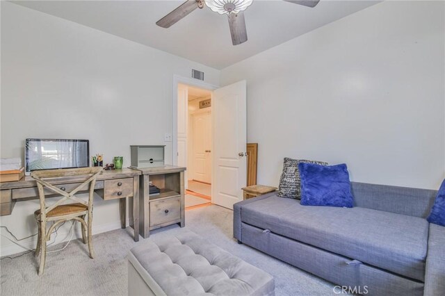 office space featuring light colored carpet and ceiling fan