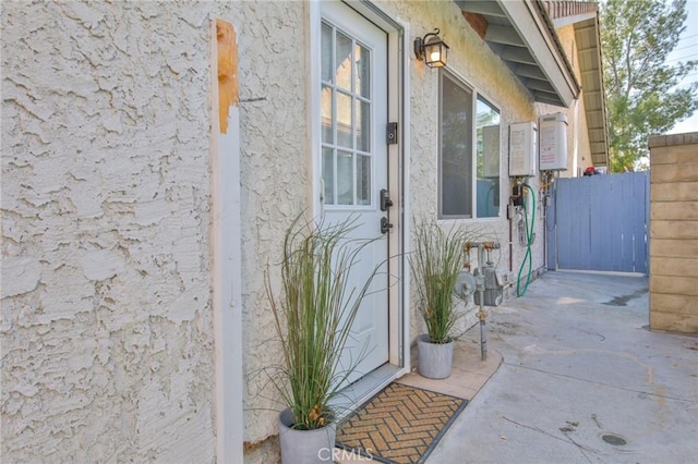 entrance to property with a patio