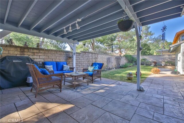 view of patio featuring a grill and outdoor lounge area