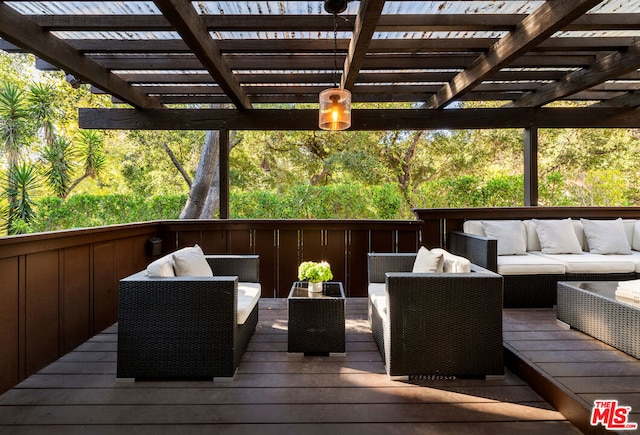 wooden terrace with outdoor lounge area and a pergola