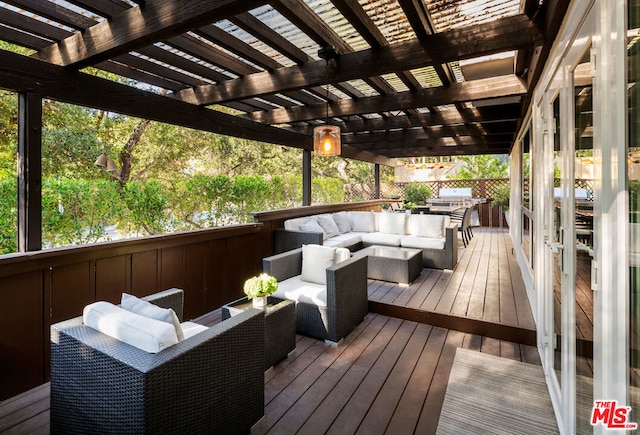 deck with a pergola and an outdoor hangout area