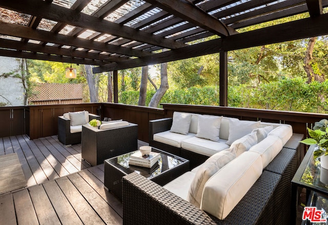 wooden deck featuring an outdoor hangout area and a pergola