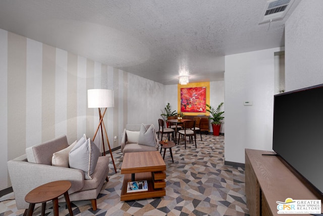 living room with a textured ceiling