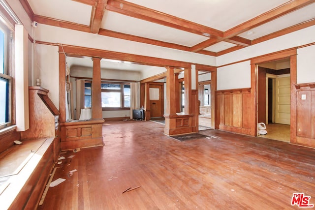 unfurnished living room with beamed ceiling, coffered ceiling, hardwood / wood-style floors, and decorative columns