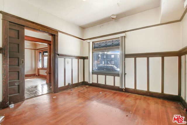 spare room featuring hardwood / wood-style floors