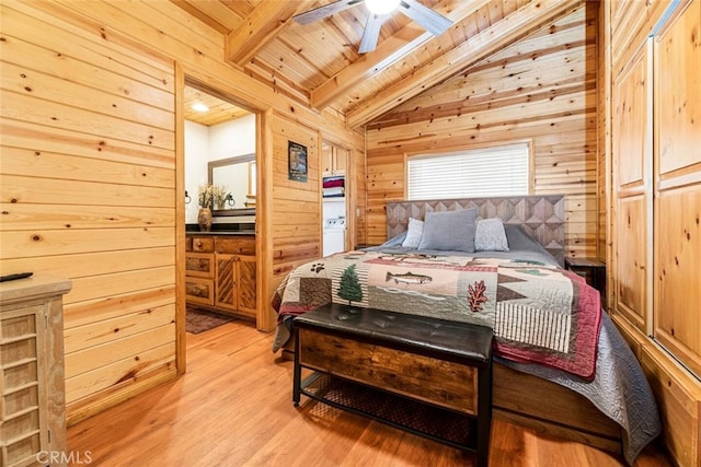 bedroom with lofted ceiling with beams, wooden ceiling, wooden walls, and light hardwood / wood-style floors