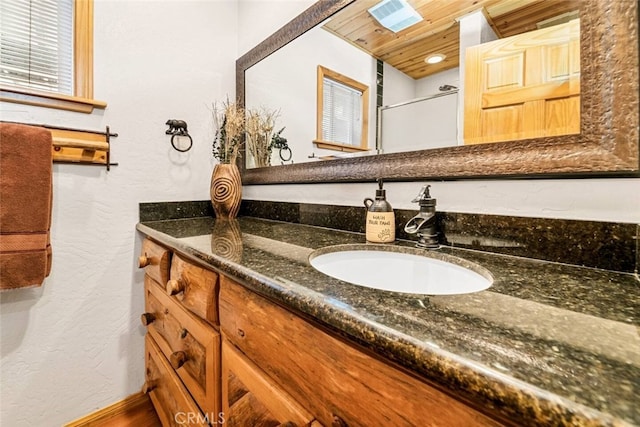 bathroom featuring vanity and wooden ceiling