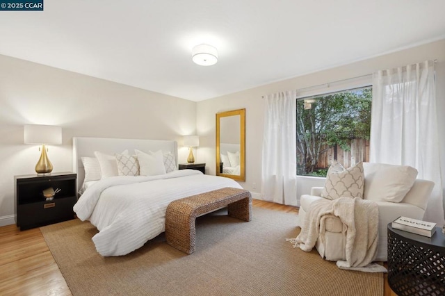 bedroom with light hardwood / wood-style floors