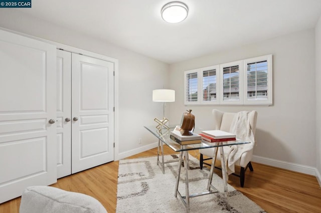 office space with light wood-type flooring