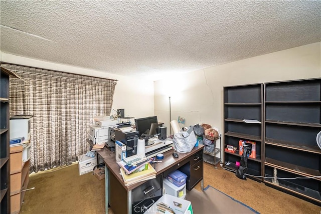 home office with a textured ceiling and carpet flooring