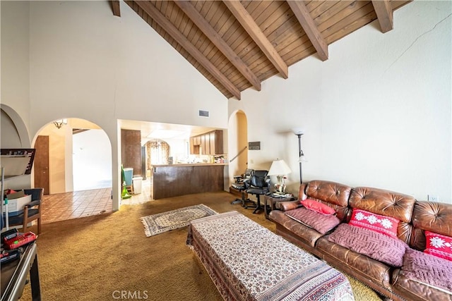 living room featuring wood ceiling, carpet flooring, high vaulted ceiling, and beamed ceiling