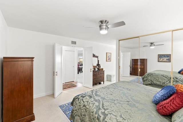 bedroom with ceiling fan and a closet