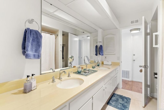 bathroom with vanity and tile patterned floors