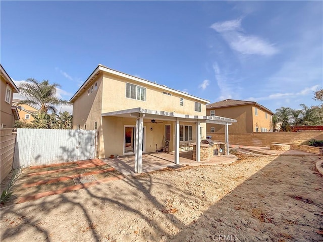 rear view of property with a pergola, a patio, and ceiling fan