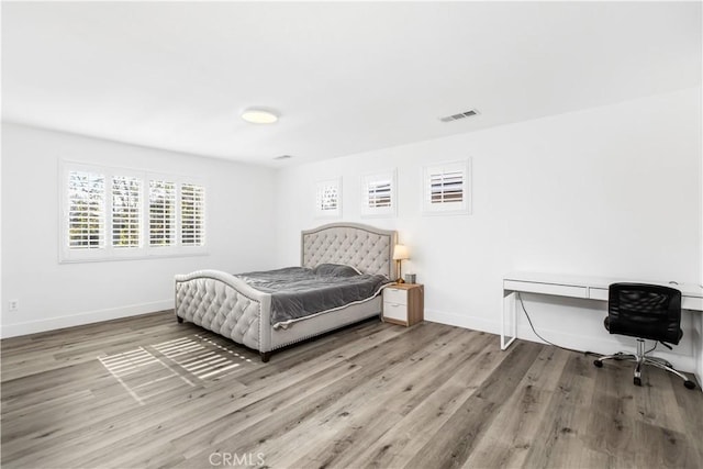 bedroom featuring hardwood / wood-style flooring