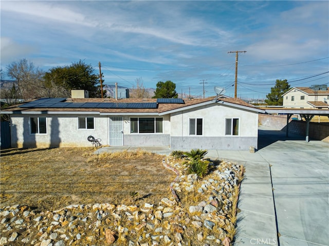 view of front of home with solar panels