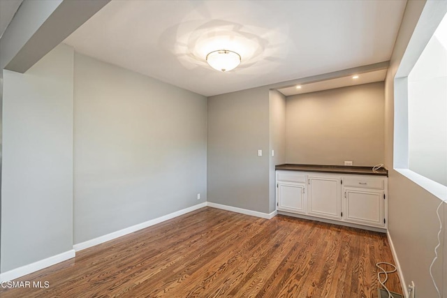 unfurnished room featuring hardwood / wood-style floors