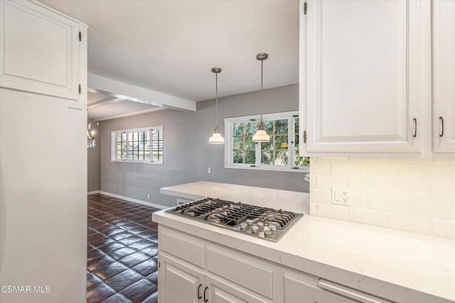 kitchen with pendant lighting, beam ceiling, stainless steel gas cooktop, and white cabinets