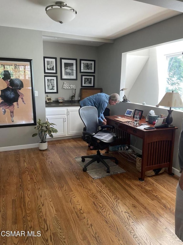 office area with hardwood / wood-style floors