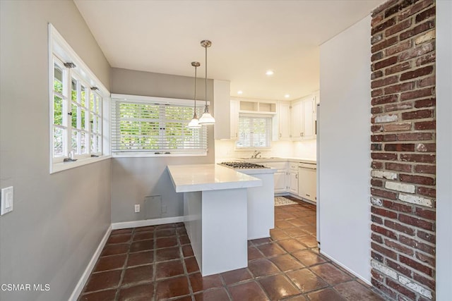 kitchen with a breakfast bar area, dishwasher, kitchen peninsula, pendant lighting, and white cabinets