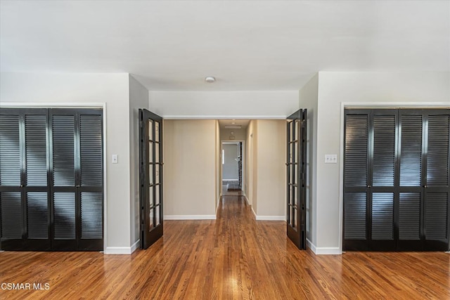 empty room with hardwood / wood-style flooring