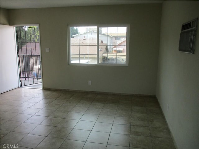 spare room featuring light tile patterned floors