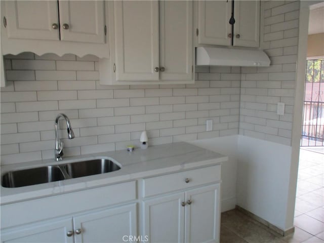 kitchen with sink and white cabinets