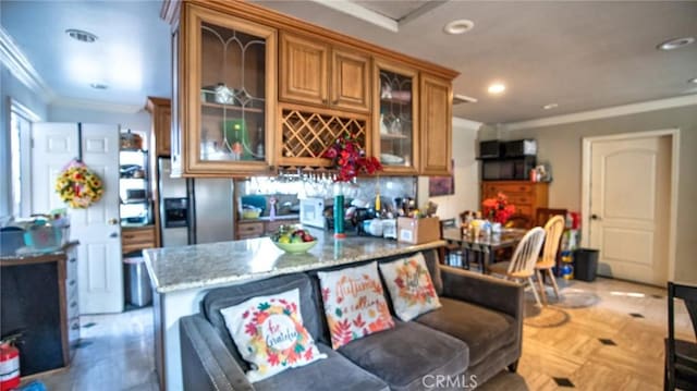 kitchen with stainless steel refrigerator with ice dispenser, a kitchen bar, ornamental molding, light parquet flooring, and light stone countertops