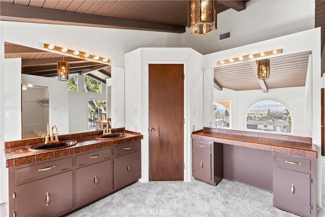 bathroom featuring vanity, lofted ceiling with beams, and wooden ceiling