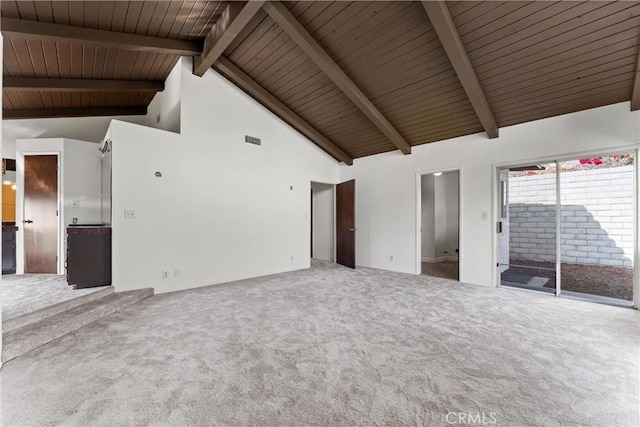 unfurnished living room featuring beam ceiling, high vaulted ceiling, carpet, and wooden ceiling