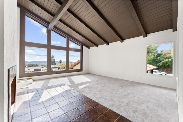 unfurnished living room with high vaulted ceiling, carpet floors, wood ceiling, and beam ceiling