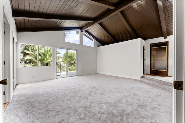 unfurnished living room with beam ceiling, light carpet, wooden ceiling, and high vaulted ceiling