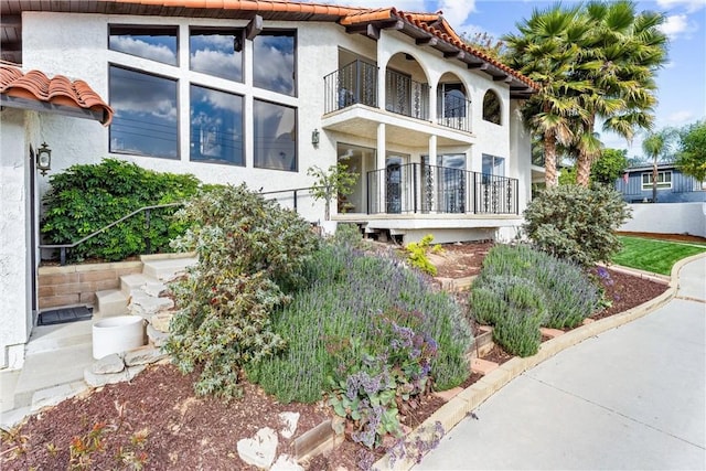 view of home's exterior featuring a balcony