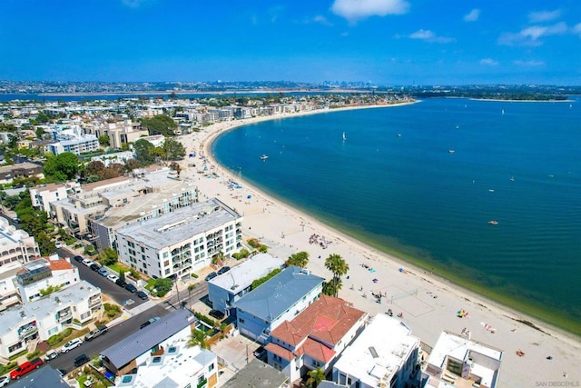 bird's eye view with a water view and a view of the beach