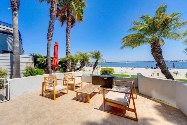 view of patio / terrace featuring a water view and an outdoor hangout area