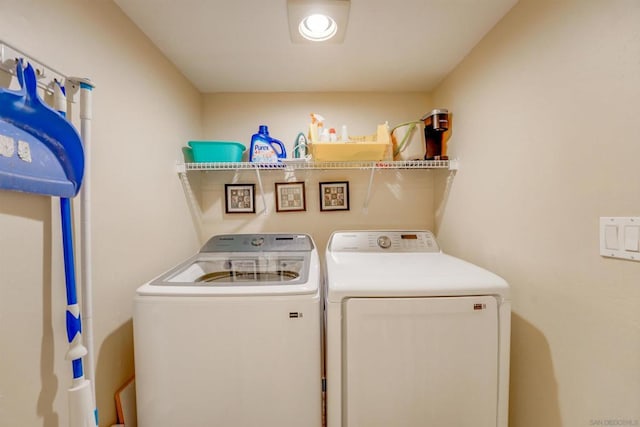 laundry area featuring washing machine and clothes dryer