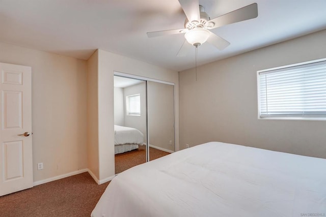 carpeted bedroom with a closet and ceiling fan