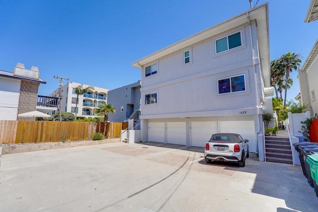 back of property with a garage