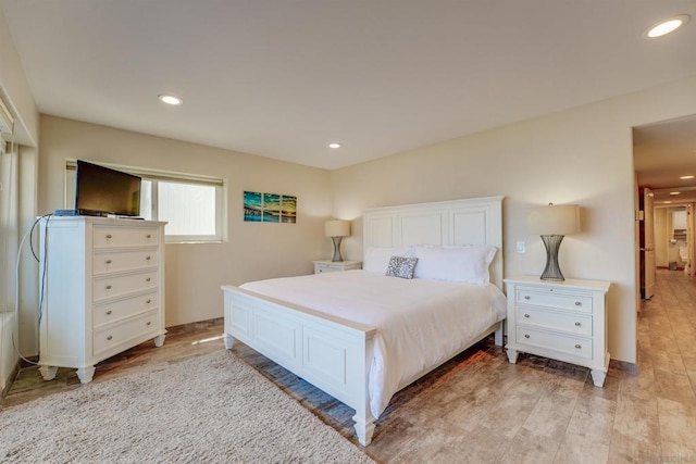 bedroom with light hardwood / wood-style flooring