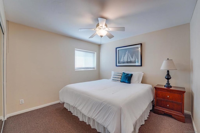 bedroom featuring ceiling fan and dark colored carpet