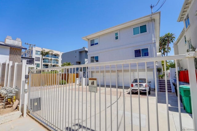 view of gate with a garage