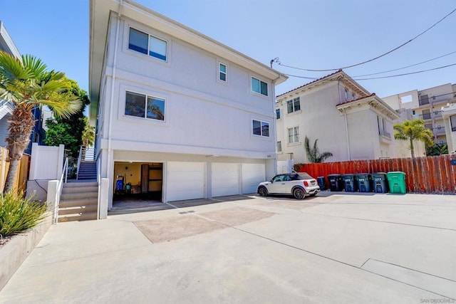 back of house with a garage