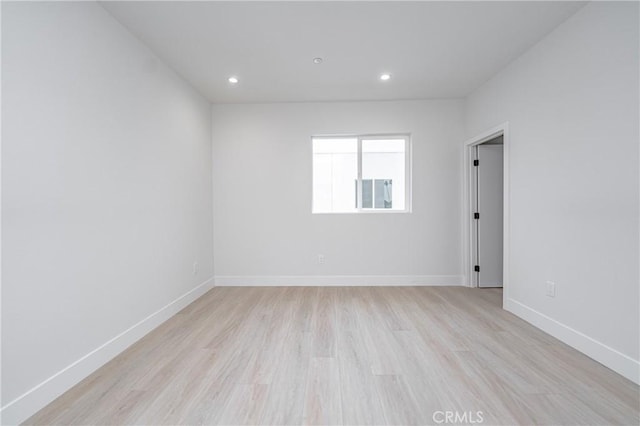 unfurnished room with light hardwood / wood-style flooring