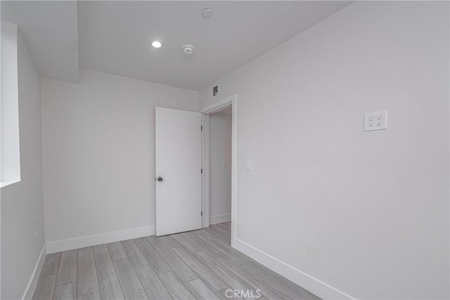 unfurnished room featuring light hardwood / wood-style flooring