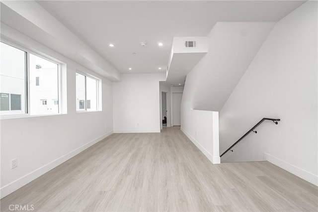 bonus room with light hardwood / wood-style floors