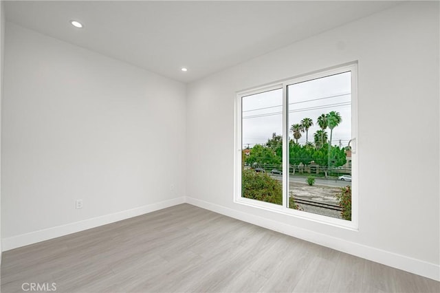 unfurnished room featuring light hardwood / wood-style flooring