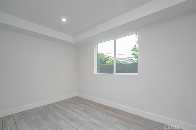 spare room featuring light hardwood / wood-style flooring