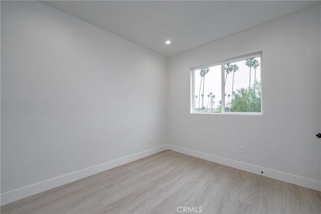 unfurnished room with light hardwood / wood-style flooring