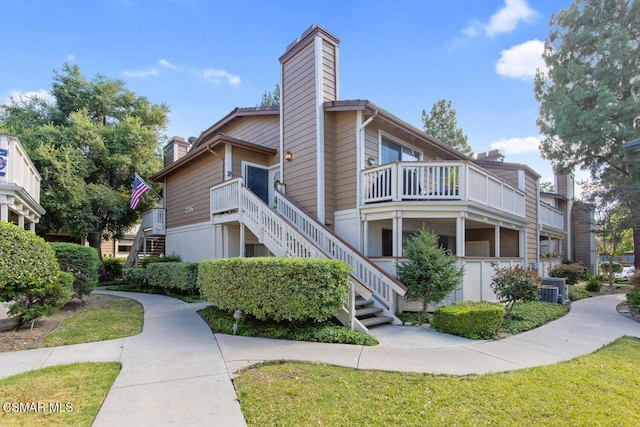 view of home's exterior featuring central AC unit and a lawn