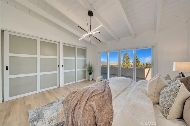 bedroom featuring an inviting chandelier, wood-type flooring, lofted ceiling with beams, access to outside, and wooden ceiling